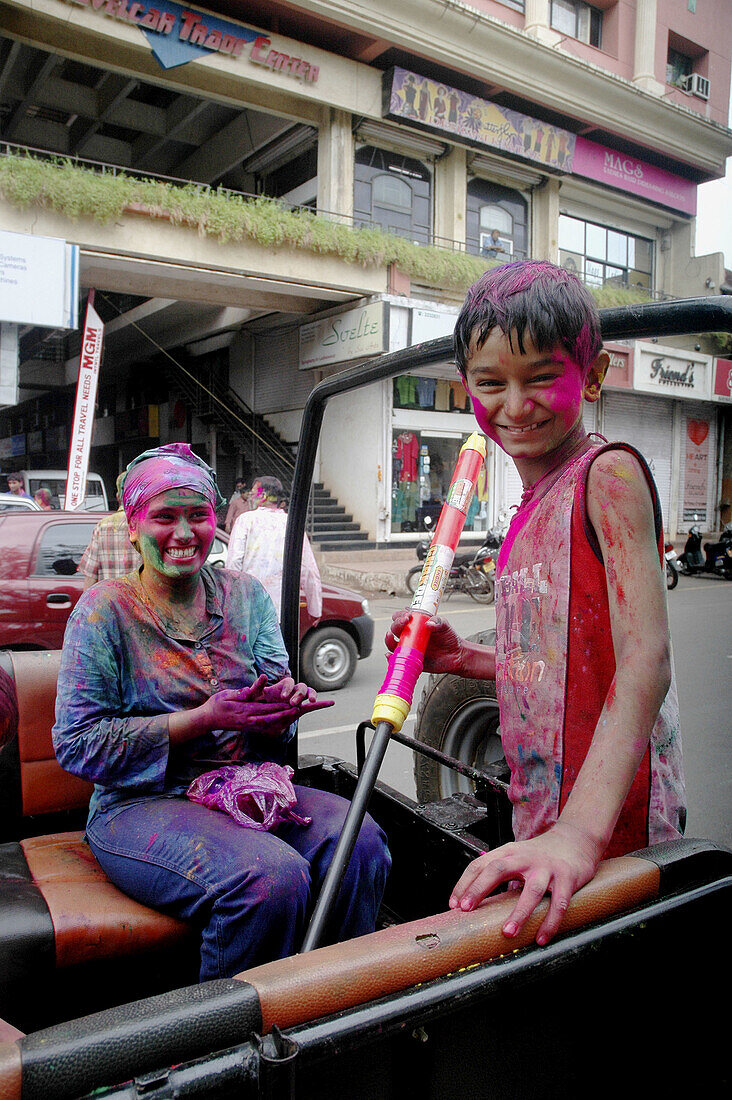 Panjim Goa, India, children with colored powder on their faces during the Holi feast
