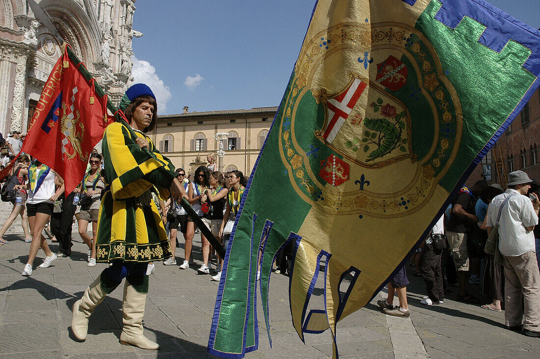 Siena Italy, flag-weavers of the Contrada del Bruco in front of the Dome during the Palio