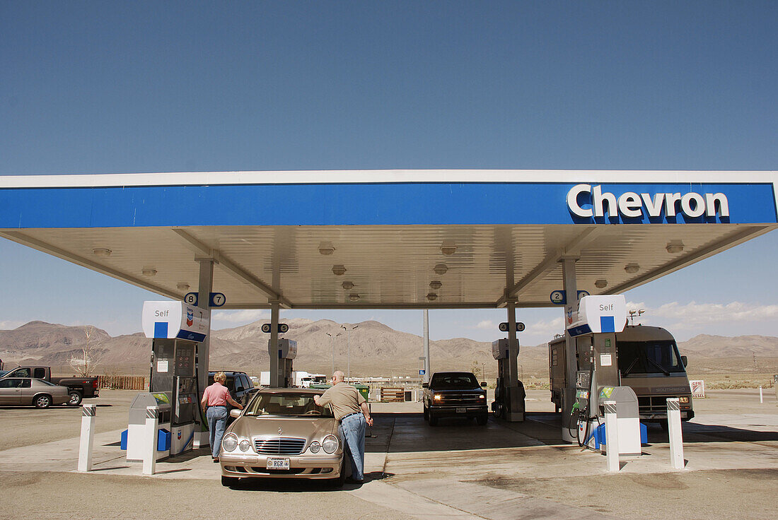California Usa, filling up a car at a gasoline station along the highway