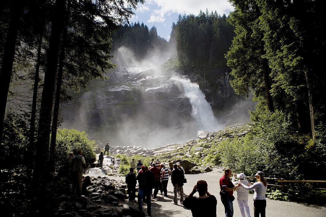 Tourists visiting the cascade of Krimml in the forests of National Park Hohe, in the Austrian Tirol, Austria, Germany, Europe.