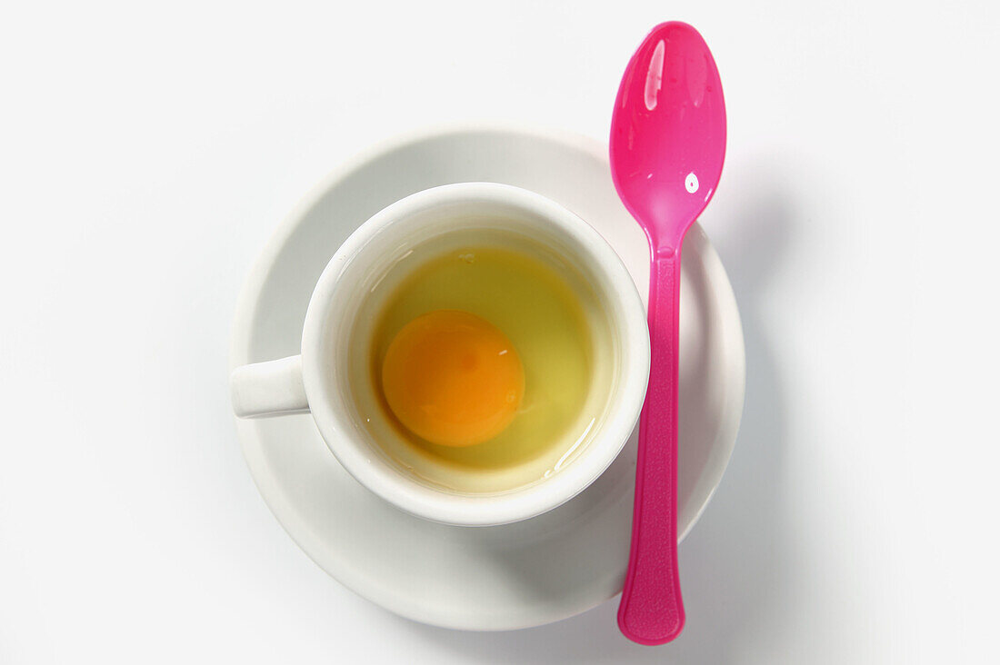 Fresh egg in a big breakfast cup