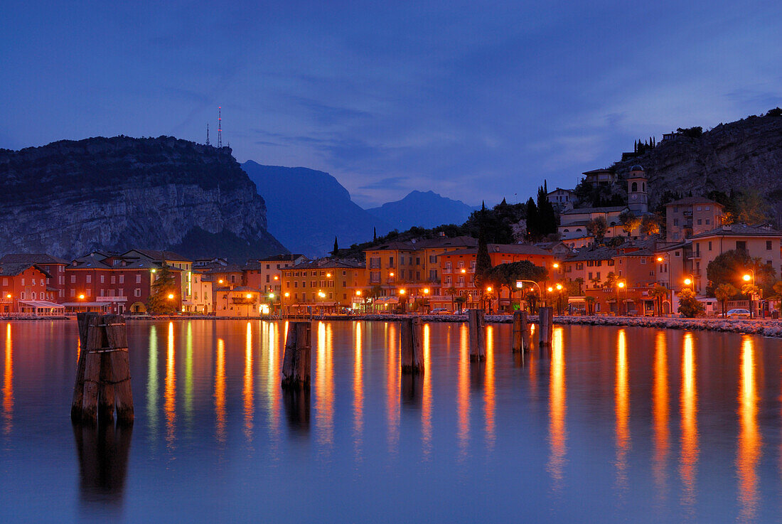 View over lake Garda to illuminated Nago-Torbole, Trentino-Alto Adige/Südtirol, Italy