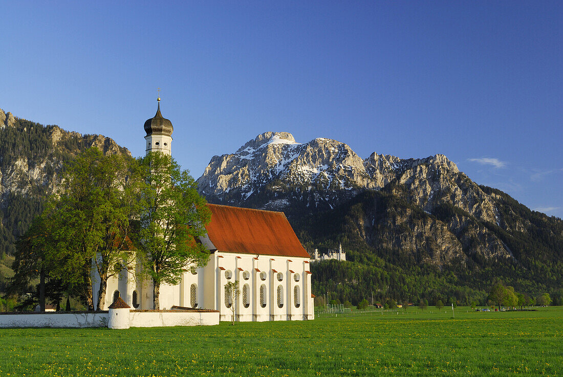 St. Coloman church with Neuschwanstein Castle, near Schwangau, Allgaeu, Bavaria, Germany