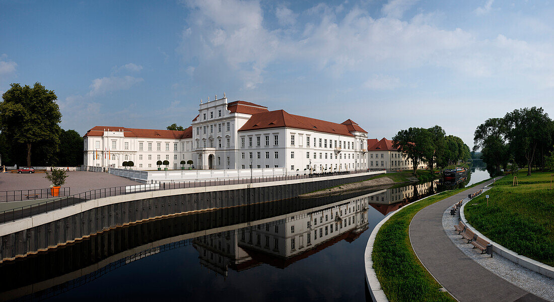 Oranienburg castle with reflection in the water, Brandenburg, Germany