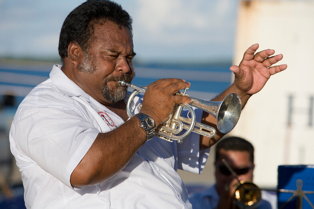 Tongan Brass Band Leader playing the trumpet on MV Columbus, Nuku'alofa, Tongatapu, Tonga, South Pacific, Oceania