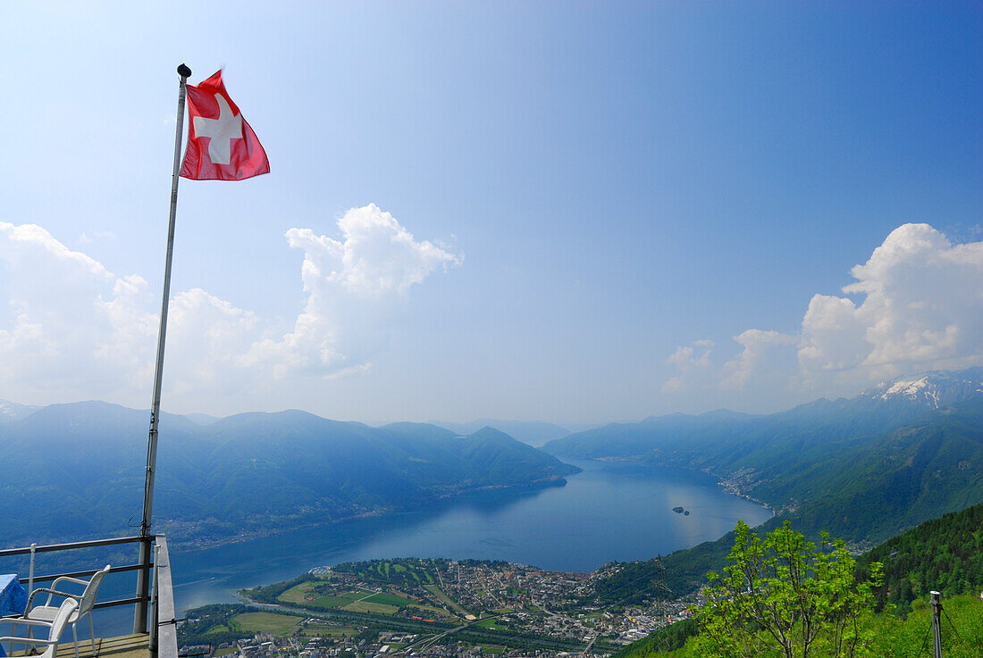 Flag of Switzerland above delta of river Maggia with Locarno and Ascona at lake Maggiore, Alpe Cardada, Locarno, Lago Maggiore, Ticino, Switzerland