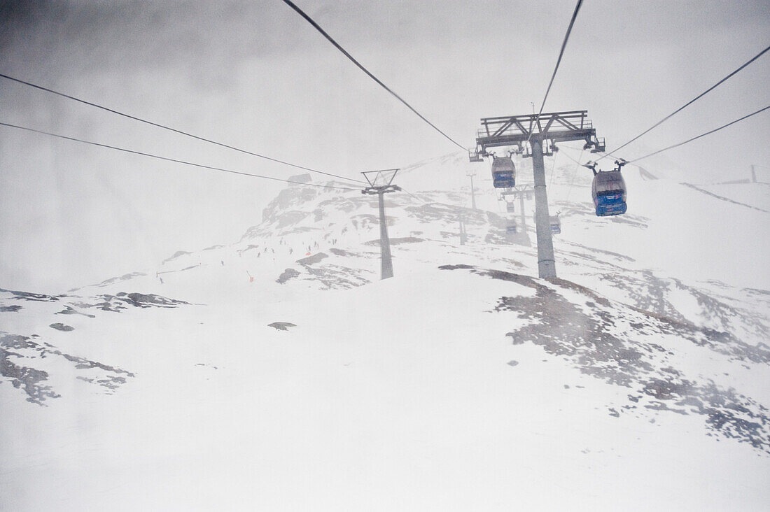 Aerial cableway in fog, Hintertux, Tyrol, Austria