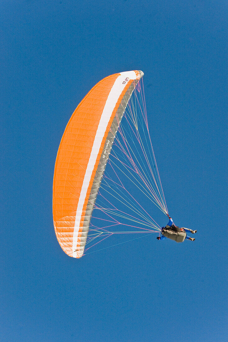 Paraglider against clear sky, Dolomites, Trentino-Alto Adige/Südtirol, Italy