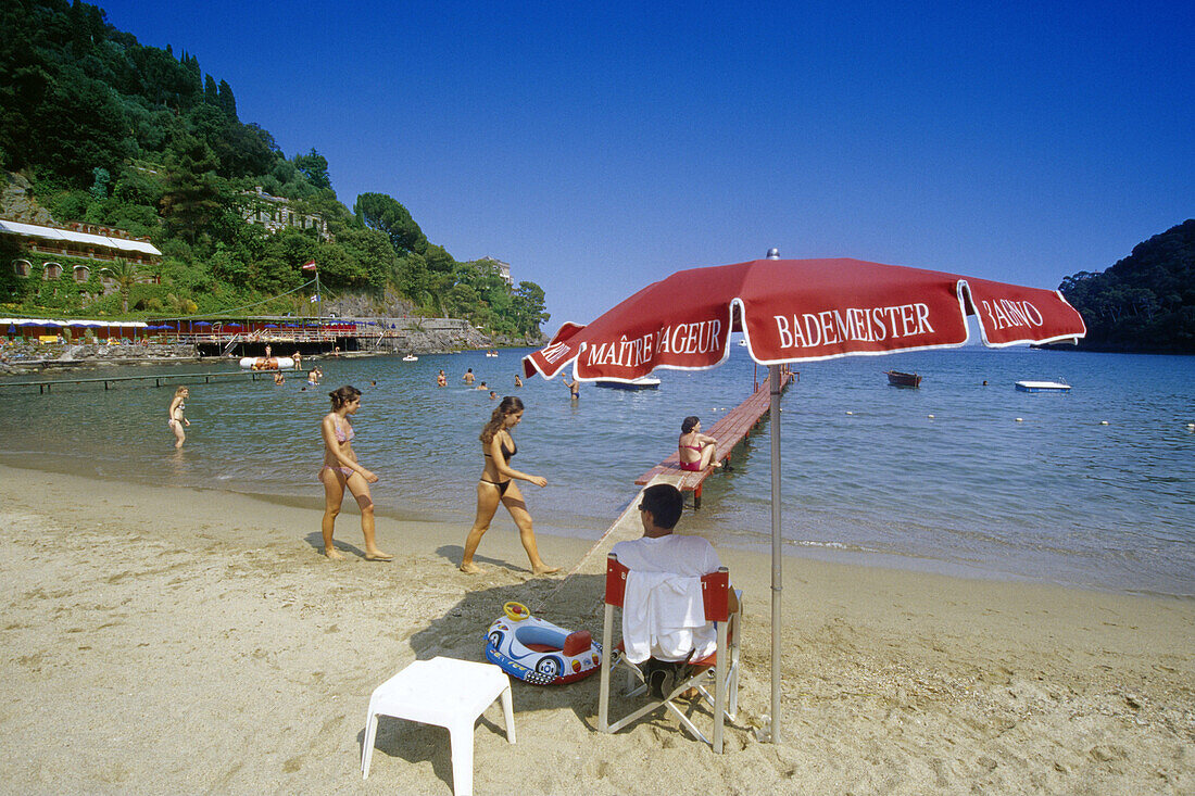 People on the beach under blue sky, Golfo di Tigullio, Liguria, Italian Riviera, Italy, Europe