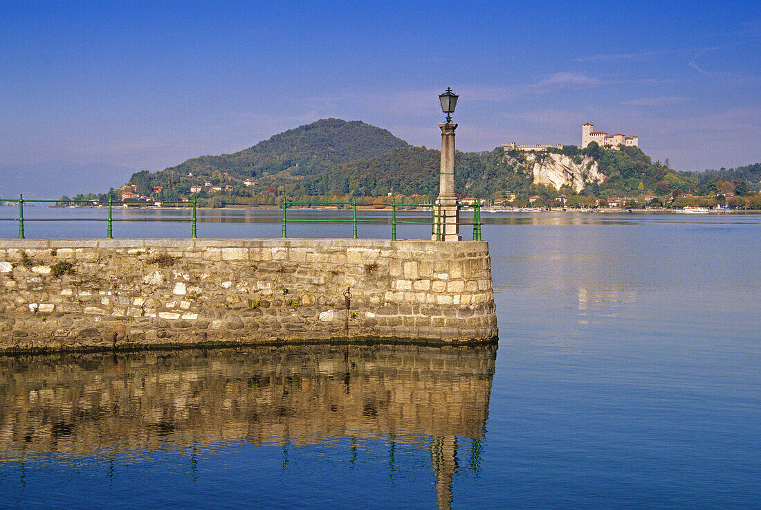 View over the lake to fort Rocca di Angera, Lago Maggiore, Piedmont, Italy, Europe