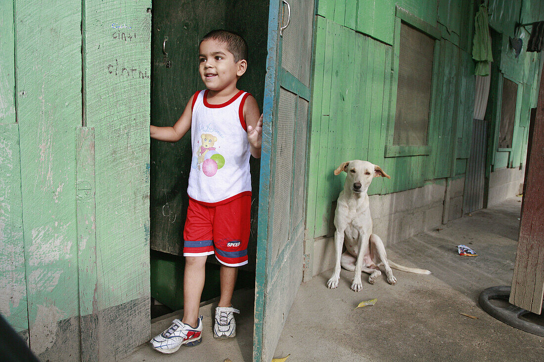 HONDURAS  Boy and dog   The slum barrio of Chamelecon, San Pedro Sula