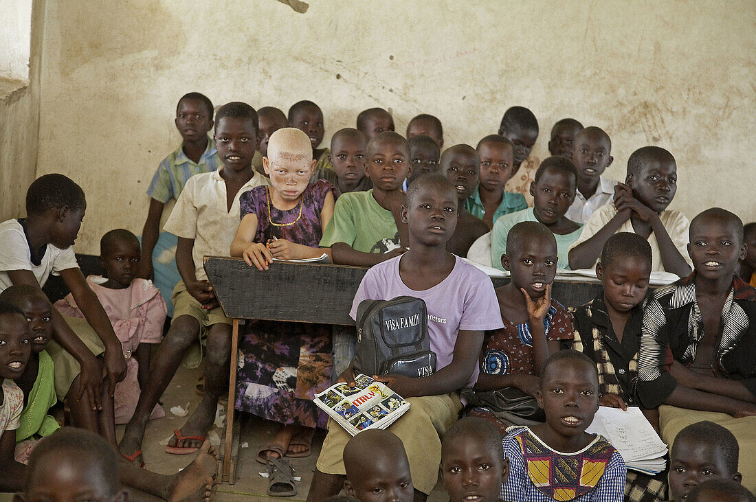 SOUTH SUDAN  Kinji government primary school, Yei  Group of children in class, including one albino girl