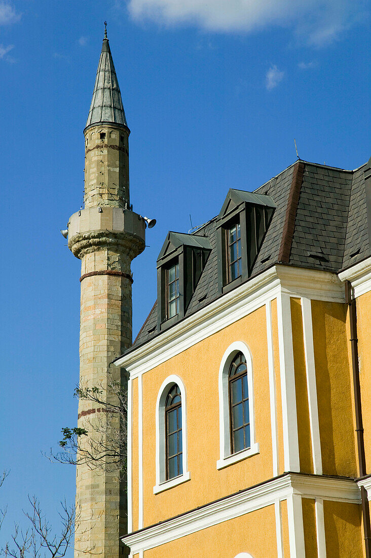 Kosovo. Prishtina. Museum of Kosovo. Exterior with minaret from the Jashar Pasha Mosque