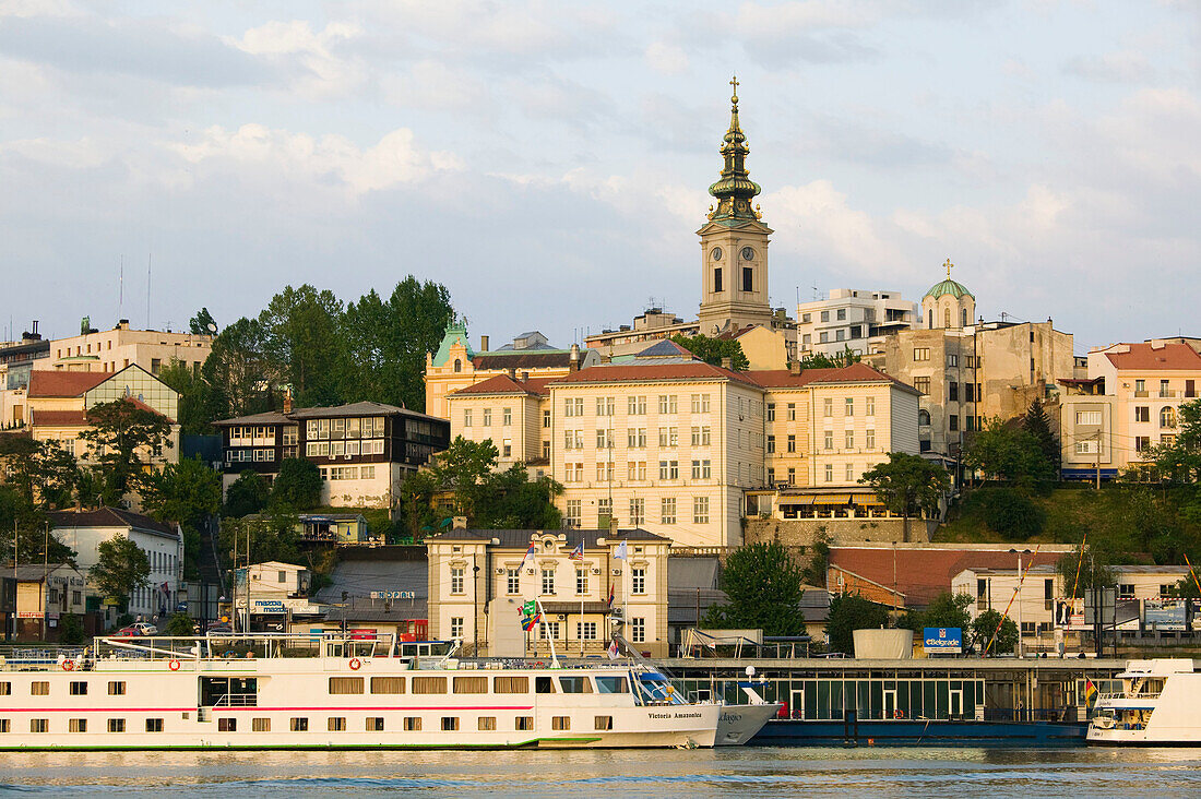 Serbia. Belgrade. Danube River Barges and Stari Grad (Old Town) / Sunset