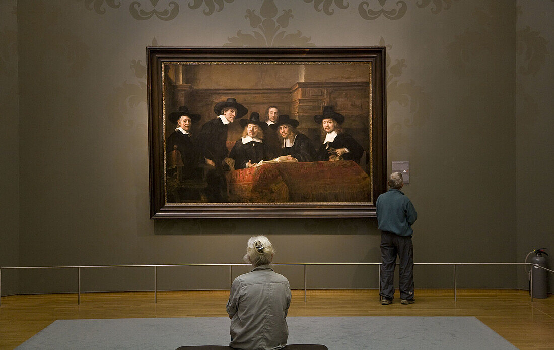 Couple looking at painting in The Rijksmuseum, Amsterdam, The Netherlands