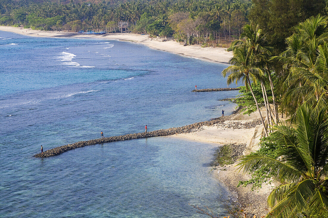 Mangsit Beach near Senggigi, Lombok, Indonesia. Fisherman on beach