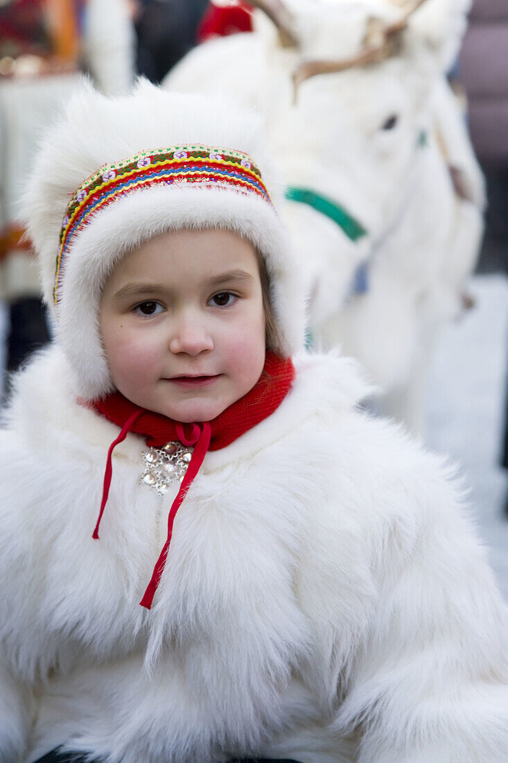 Sami (Lapp) girl in traditional clothes at Winter Fair. Jokkmokk, Northern Sweden