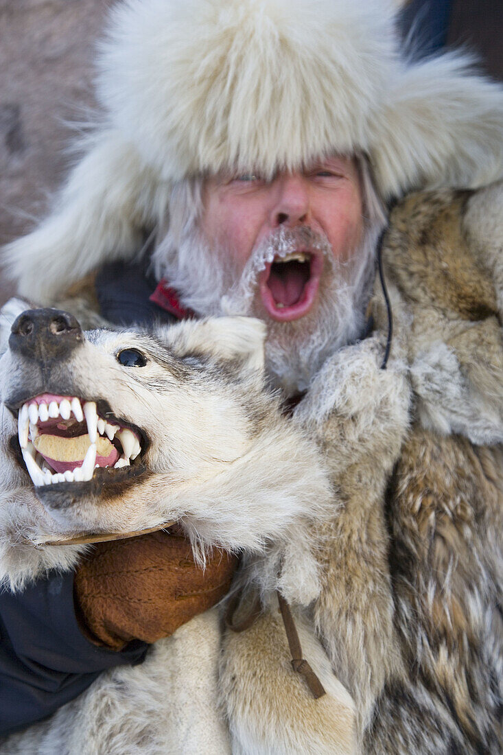 Man wearing fur coat & hat & frost covered moustache & beard at Winter Fair. Jokkmokk, Northern Sweden