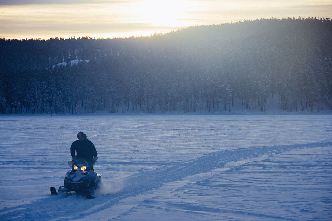 Man on snow mobile. Jokkmokk, Northern Sweden