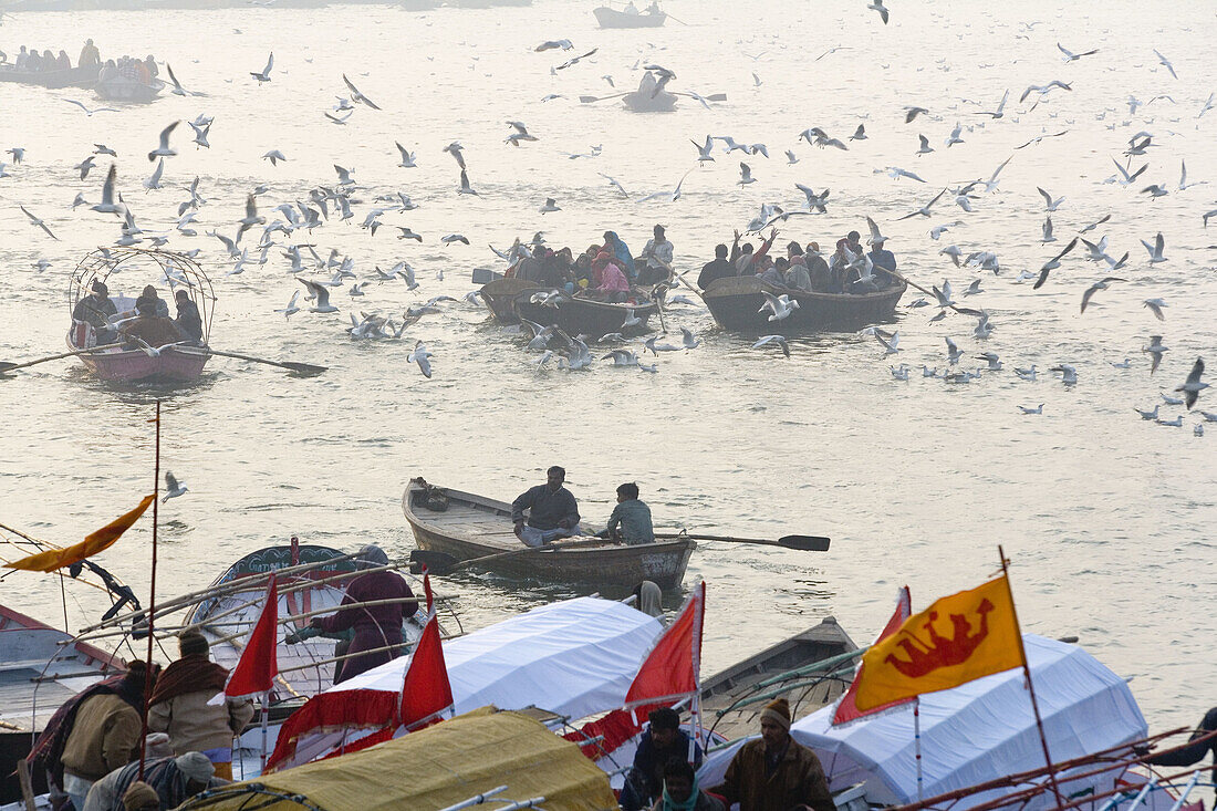 Boats with pilgrims on river Ganges at Kumbh Mela Festival. Allahabad, Uttar Pradesh, India
