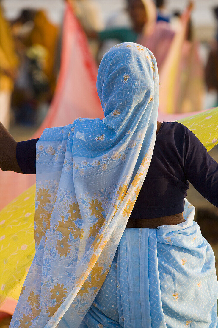 Indian woman drying sari, Allahabad, India
