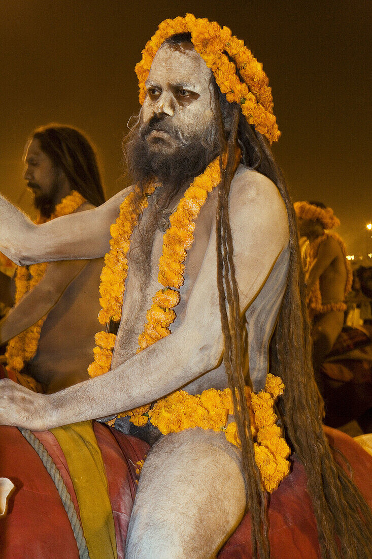 Naga Sadhus preparing for bathing in The holy river Ganges at Kumbh Mela Festival. Allahabad, Uttar Pradesh, India