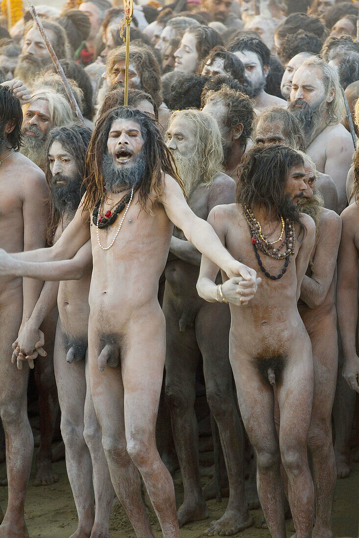 Naga Sadhus returning from bathing in The holy river Ganges at Kumbh Mela Festival. Allahabad, Uttar Pradesh, India