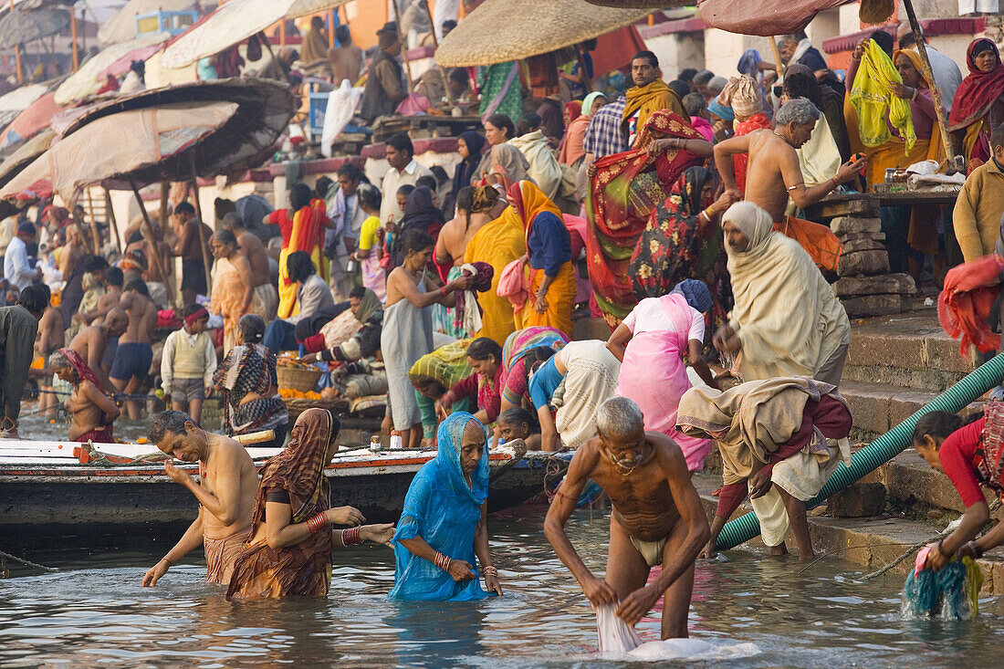 Pilgrims bathing in holy river Ganges, Varanasi, India