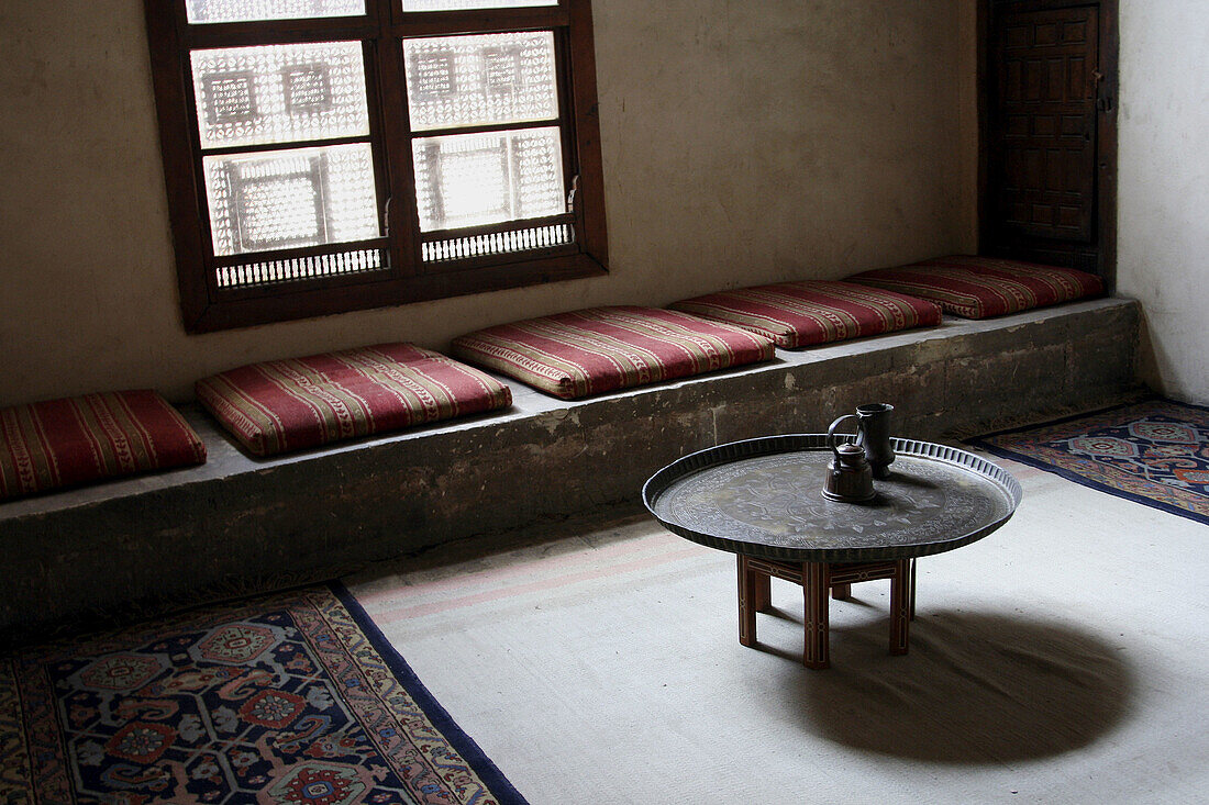 Table in room & windows (Mashrabiya) of old Arabic houses (Beyt el-Sahemy) in Cairo, Egypt