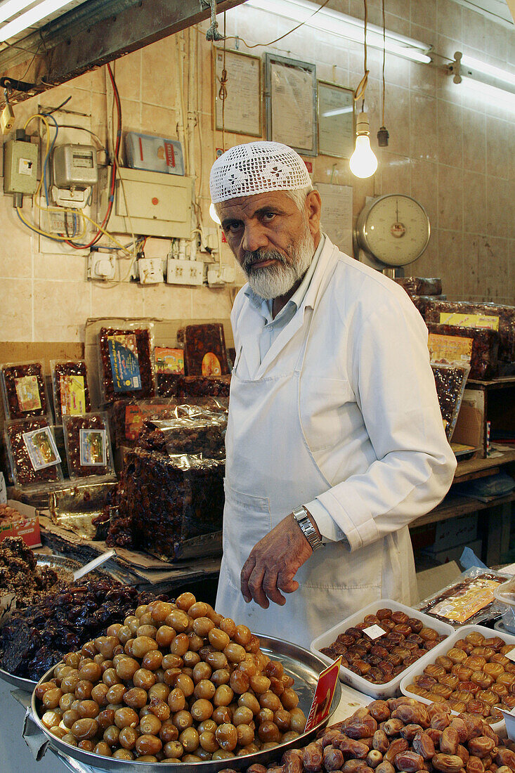 Man sales date in shop at old market, Kuwait City, Kuwait