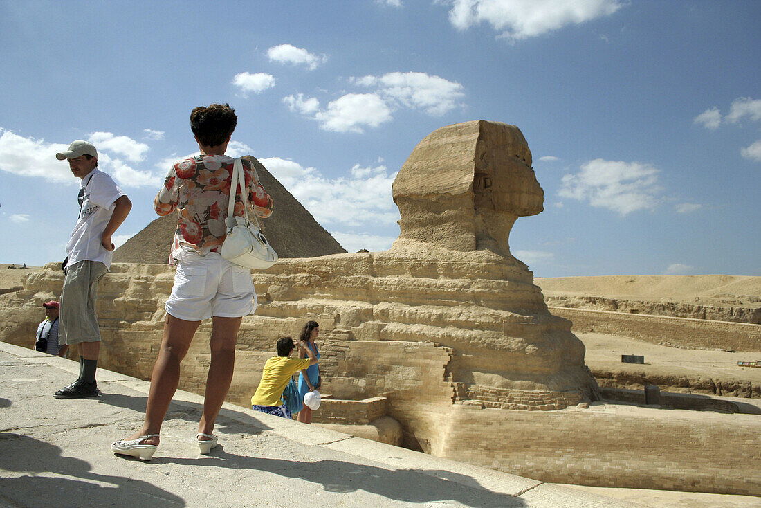 Tourists visiting thr Great Sphinx and Pyramid of Giza, Egypt