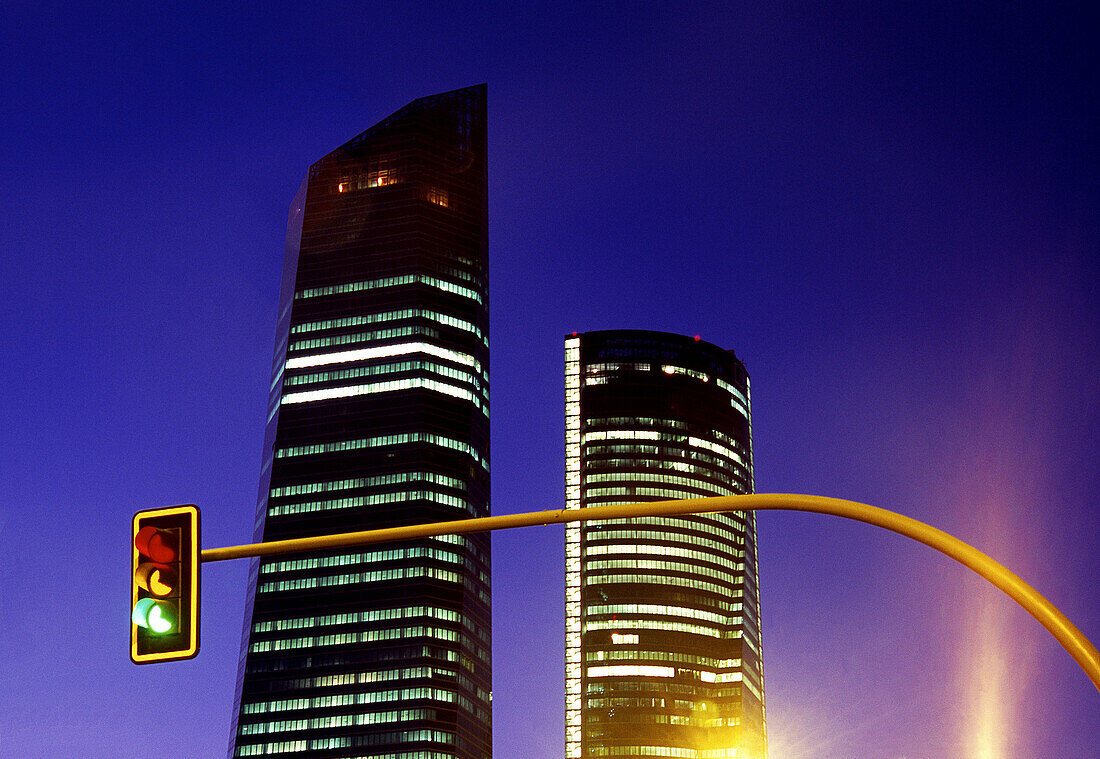 Detail of Cristal and Espacio towers and three-color traffic light  CTBA  Night view  Madrid  Spain