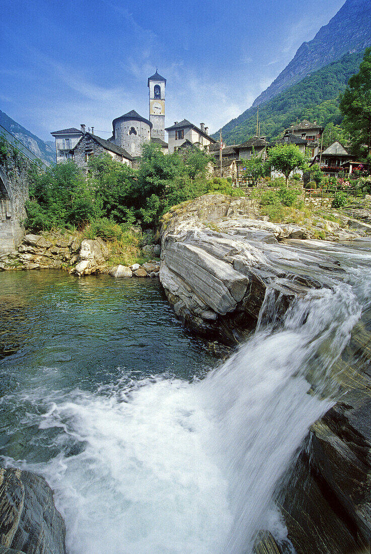 A waterfall at Valle Verzasca in front of the village Lavertezzo, Ticino, Switzerland, Europe