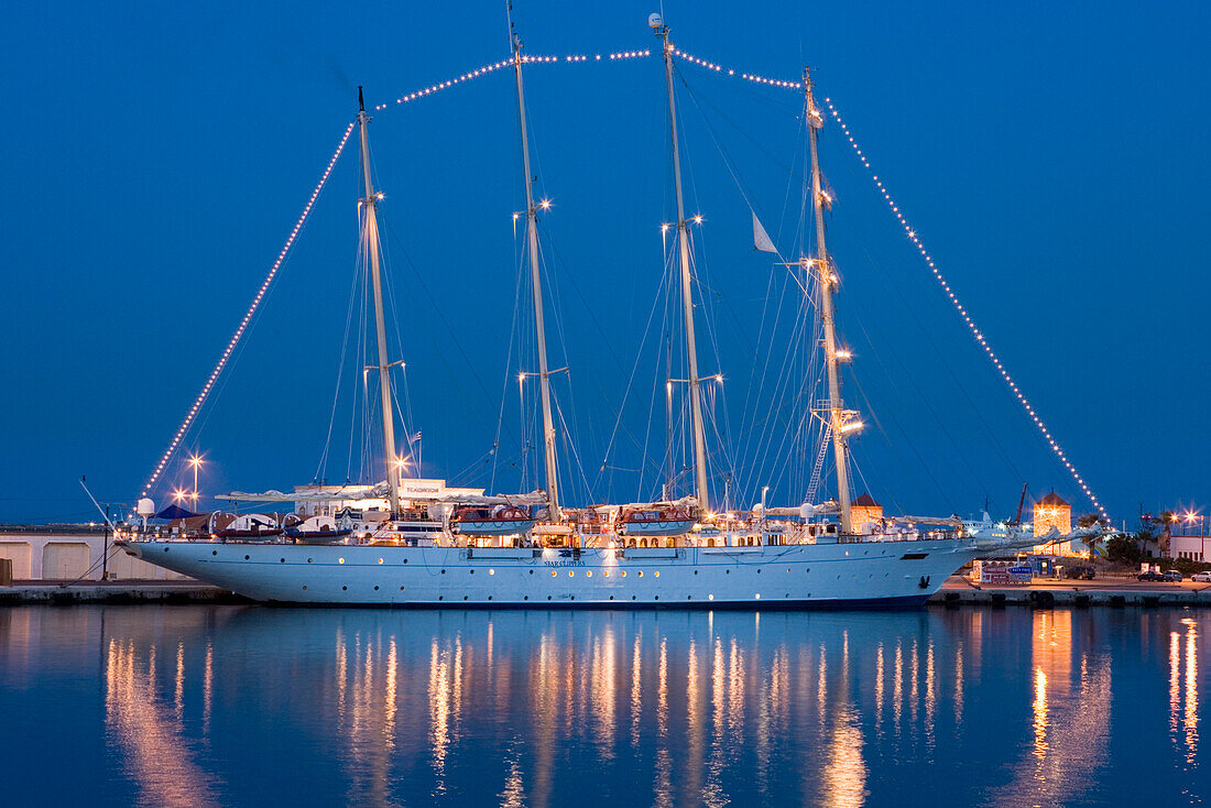 The illuminated sailing ship Star Clipper at Rhodes harbour in the evening, Rhodes city, Rhodes, Greece, Europe