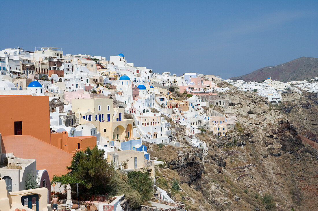 Houses at a mountainside in the sunlight, Oia, Santorini, Greece, Europe