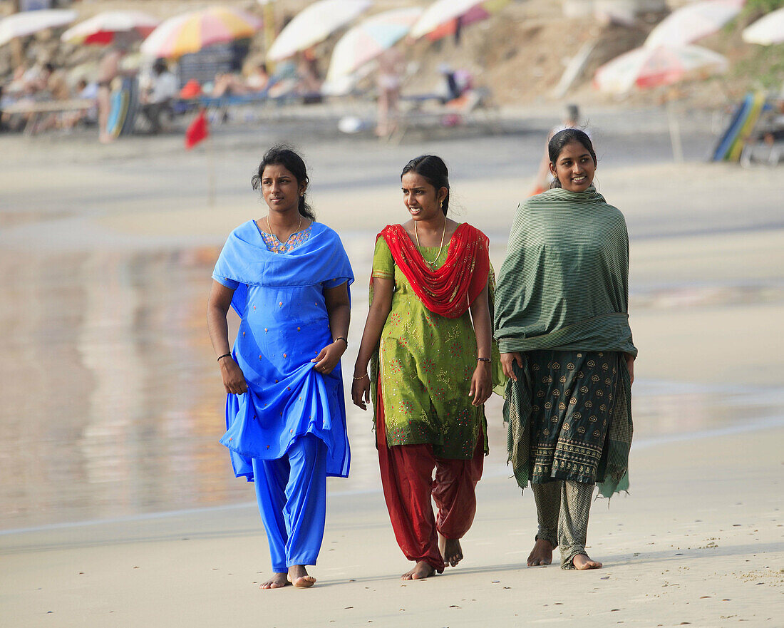Women with sari at Lighthouse beach, Kerala, India