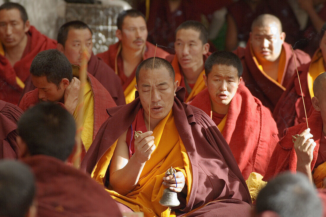 Tibetan monk offering his prayer at Jokhang Temple, Lhasa, Tibet