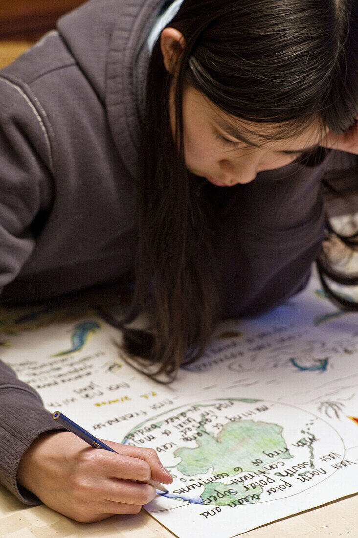 Asian, Black hair, Chinese, Color, Colour, Concentration, Contemporary, Drawing, Focus, Girl, Homework, Project, Study, Work, V01-709386, agefotostock