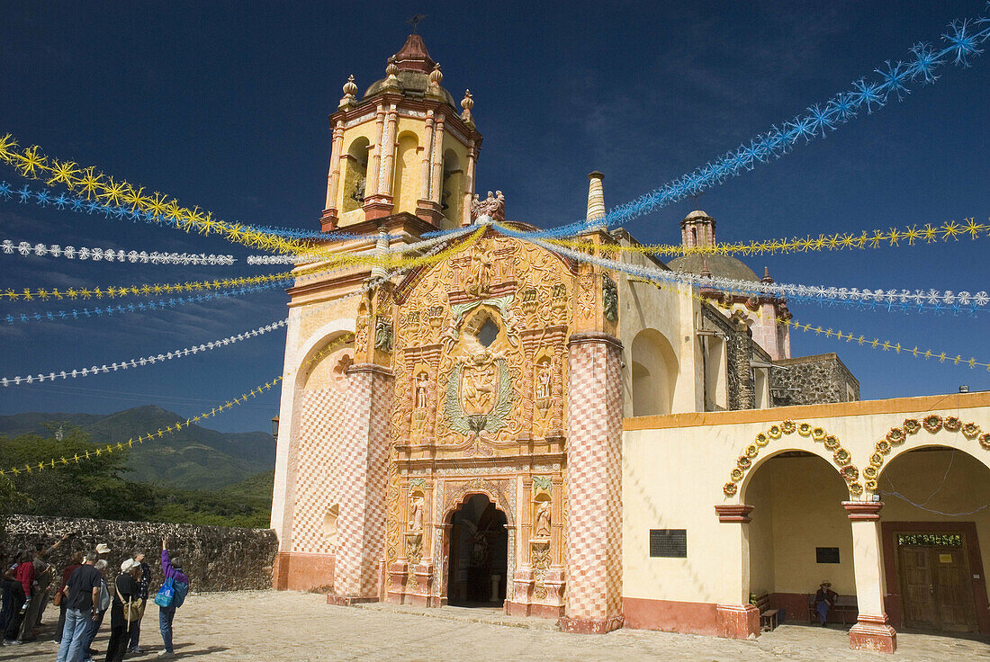 Architecture, Blue, Blue sky, Building, Buildings, Church, Churches, Color, Colour, Conca Mission, Daytime, Exterior, Franciscan mission, Franciscan missions, Garland, Garlands, Group, Groups, Holiday, Holidays, Human, Mexico, Misión Concá, Mission Conca,