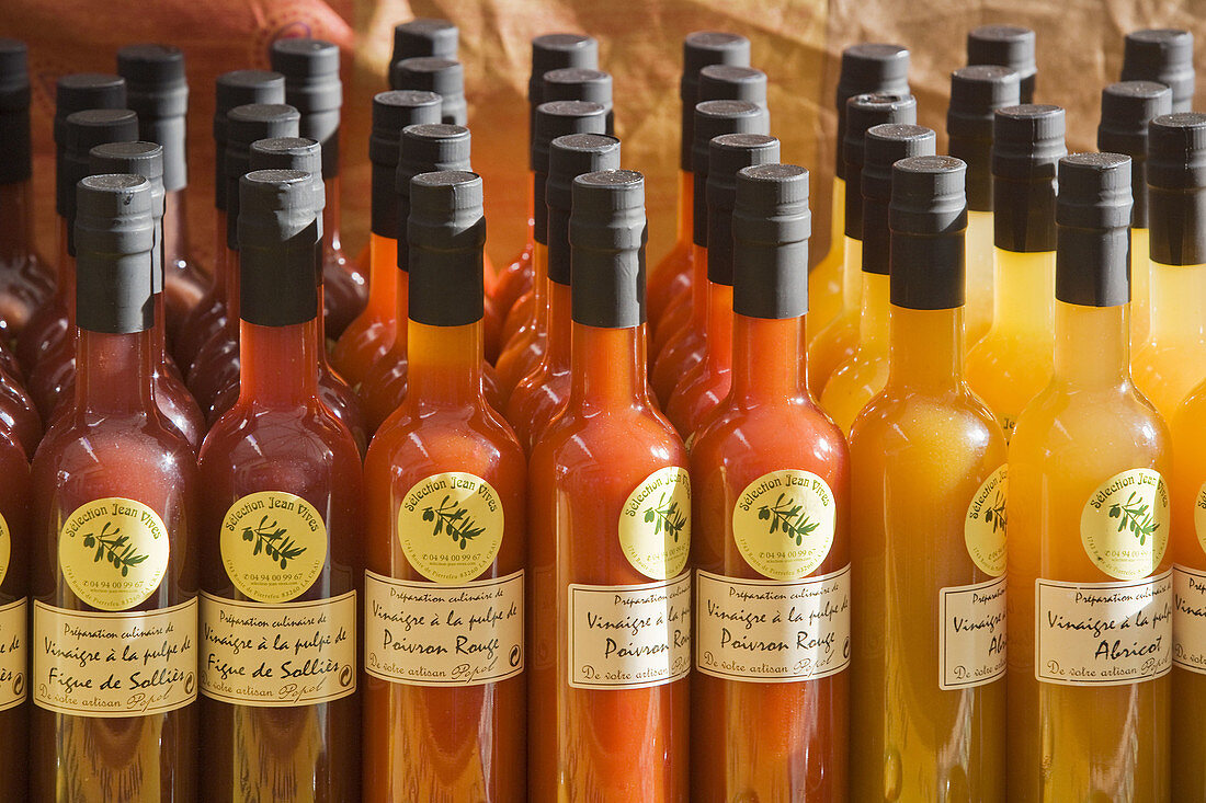 Bottles of vinegar on display on market