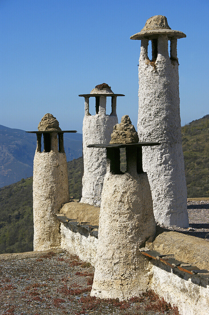 Spain. Andalusia. Granada. Typicals chimneys,  on the flats roofs,  at Bubion,  in the Alpujarras mountains.