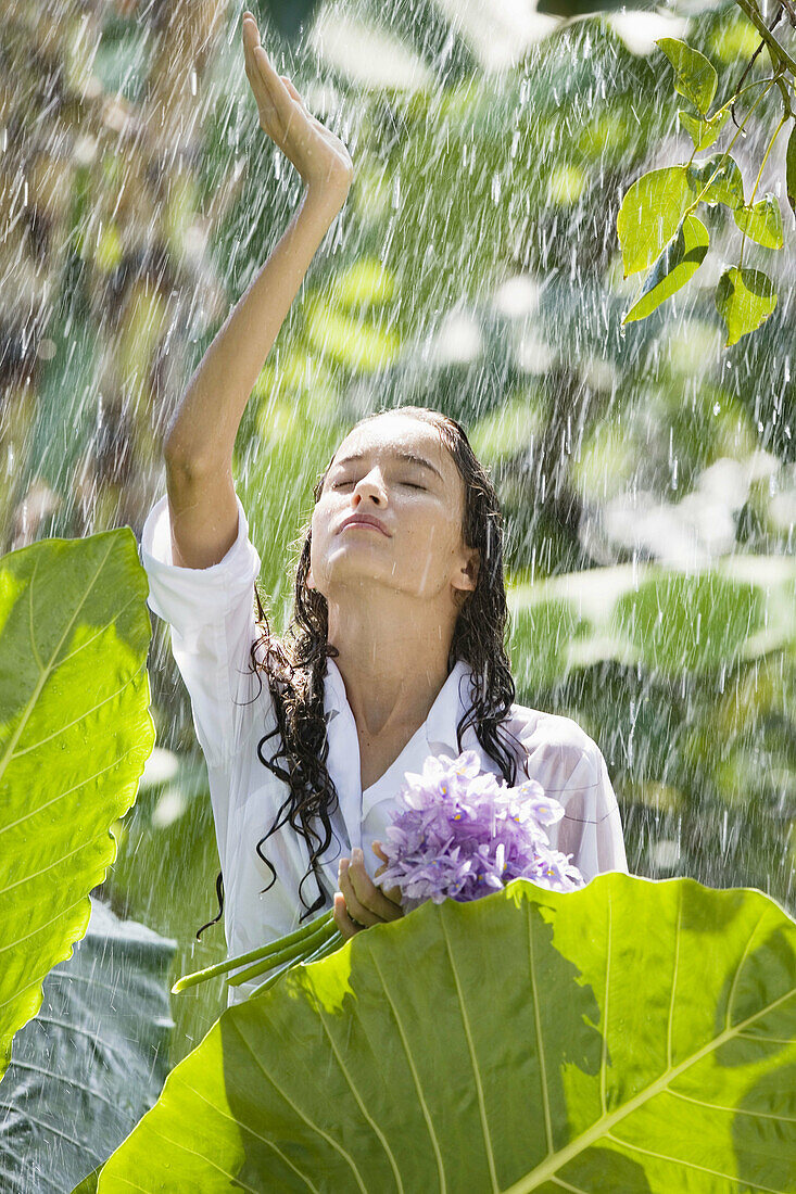 emporary, Eichornia crassipes, Eyes, Flower, Fragility, Freshness, Green, Head & shoulders, Head and shoulders, Health, Holding, Hope, One person, Outdoors, Portrait, Purple, Rain, Shoulders-up, Spa