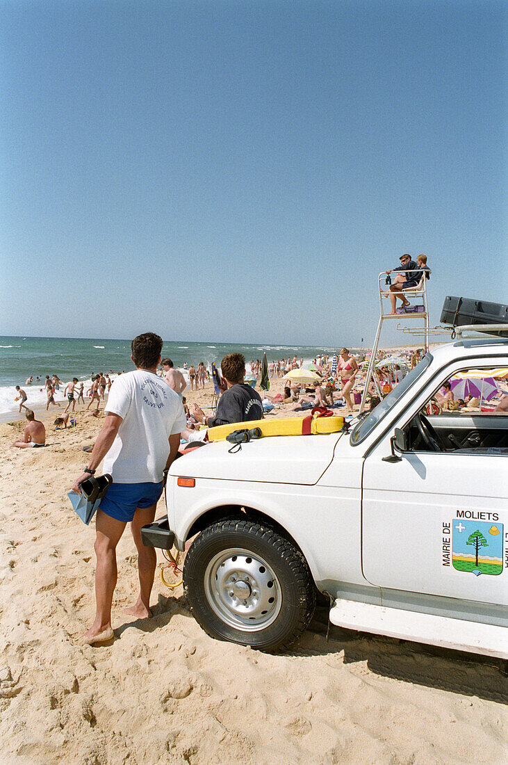 Lifeguard observing the beach, People sunbathing on the beach, Moliets, Aquitaine, France