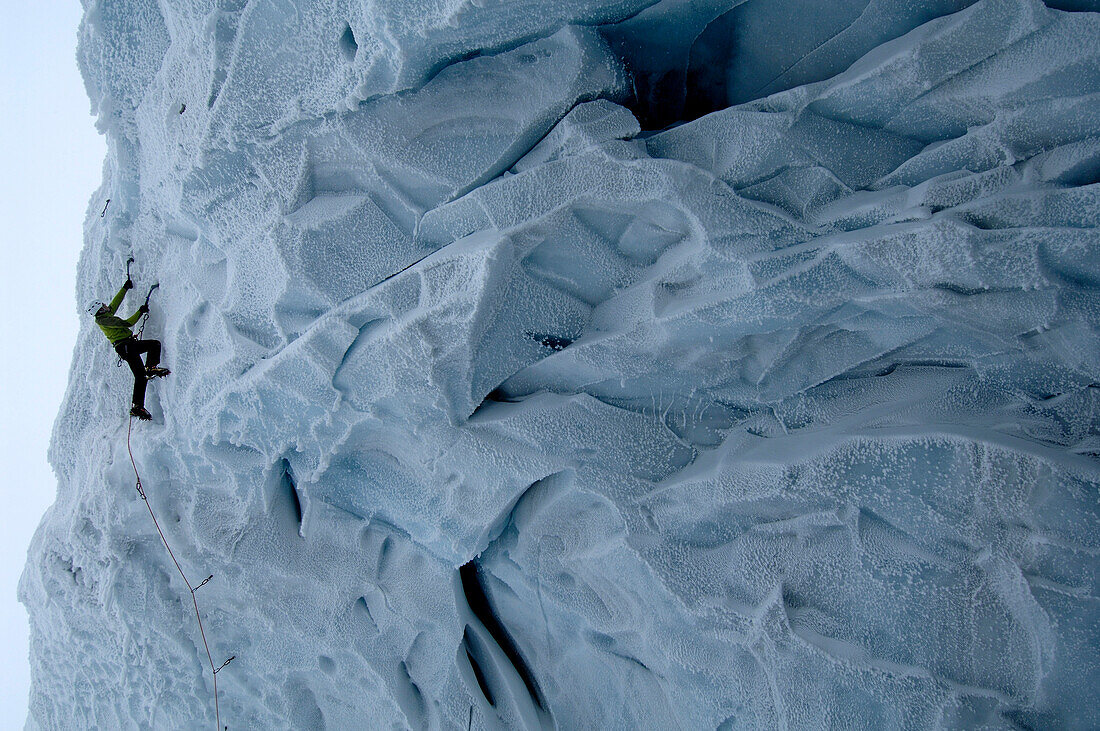 Man ice climbing at a glacier, Tyrol, Austria, Europe