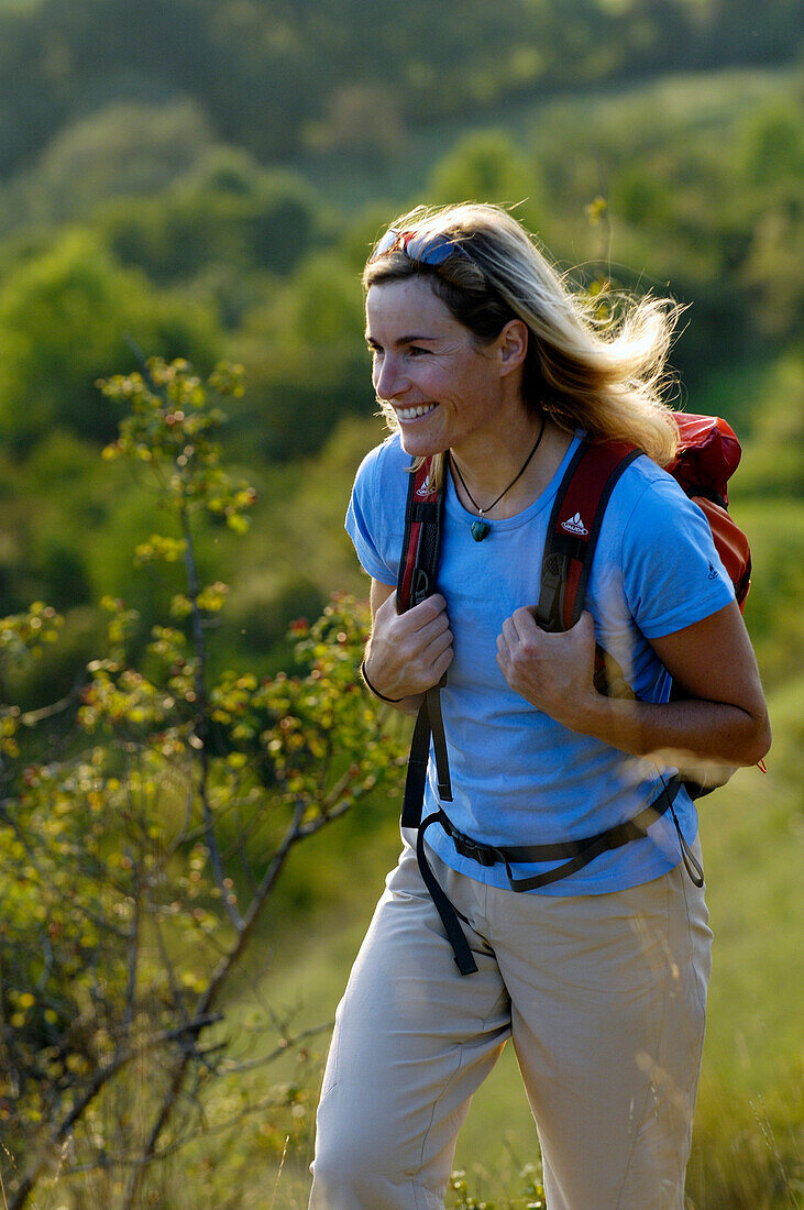 Woman with rucksack hiking at franconian Switzerland, Bavaria, Germany, Europe