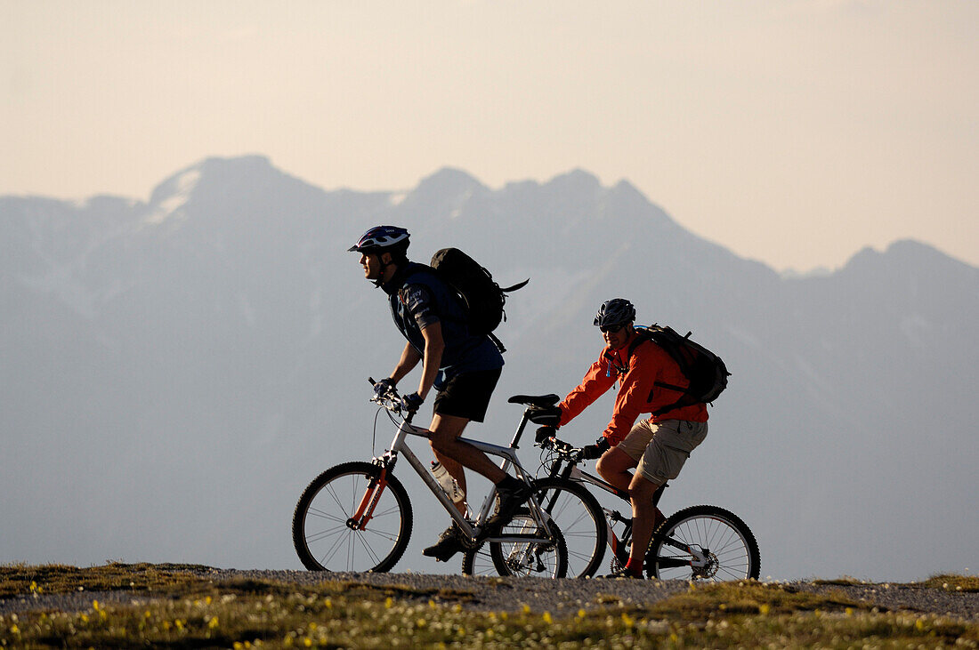 Two people on a mountain bike tour near Blaser, near Steinach am Brenner, Wipptal, Tyrol, Austria