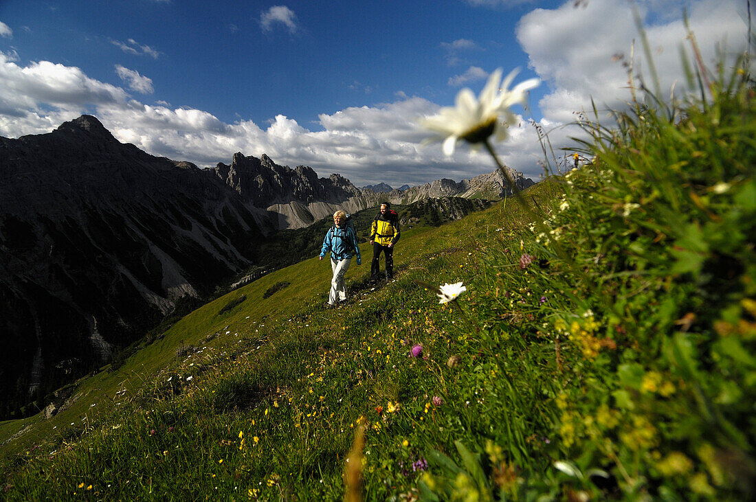 Couple hiking in the mountains, Tannheimer Mountains, Allgaeu Alps, Tirol, Austria, Europe