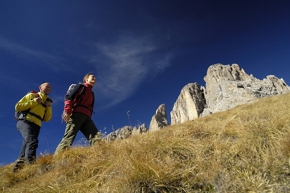 Couple mountain hiking, Gardena Pass, Trentino-Alto Adige/Südtirol, Italy