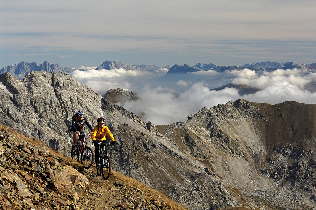 Couple mountain biking, Lenzerheide, Canton of Grisons, Switzerland