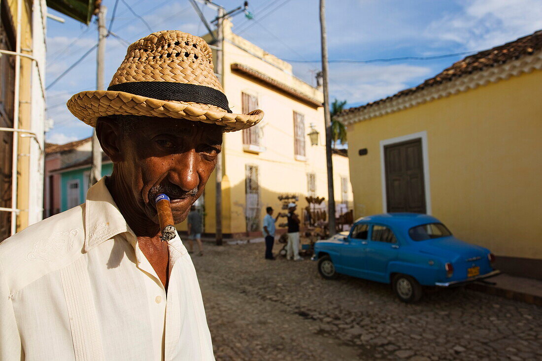 Senior man smoking cigar, Trinidad, Sancti Spiritus, Cuba, West Indies